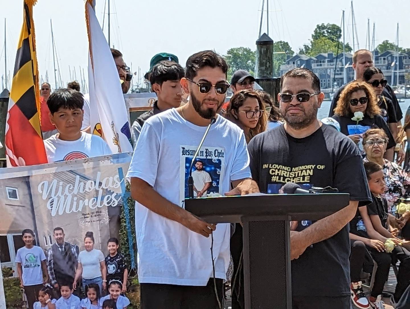 Julian Segovia, left, and his father, Christian Segovia Sr., talk about Christian Segovia Jr. during a vigil Sunday in for the three people killed during a mass shooting in Annapolis on June 11.