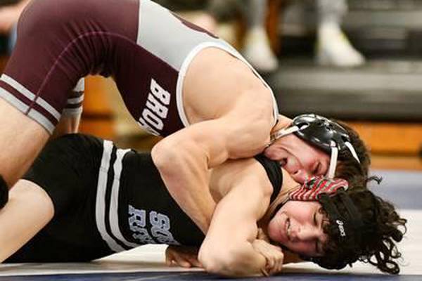 Broadneck's Ben Durkin (top) had his way with South River's Sam Travis during Wednesday's Anne Arundel County wrestling dual match. Durkin won by pin as the Bruins defeated the reigning Class 3A state champ Seahawks, 40-25, in Edgewater.