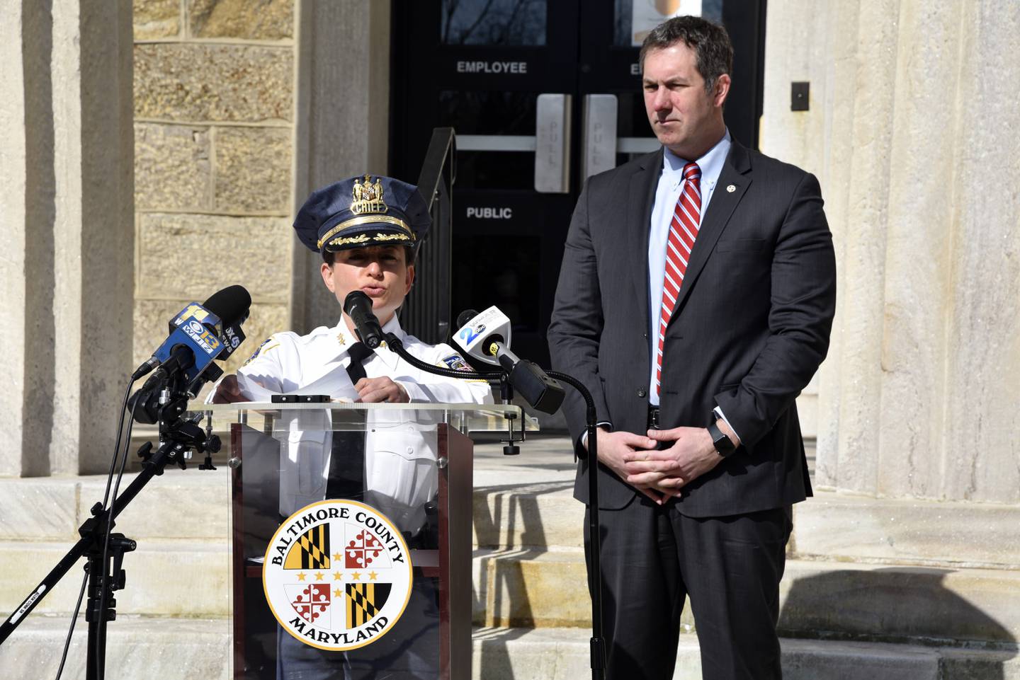 Baltimore County Police Chief Melissa Hyatt and Baltimore County Executive Johnny Olszewski Jr. speak outside the Historic Courthouse in Towson April 4, 2022.