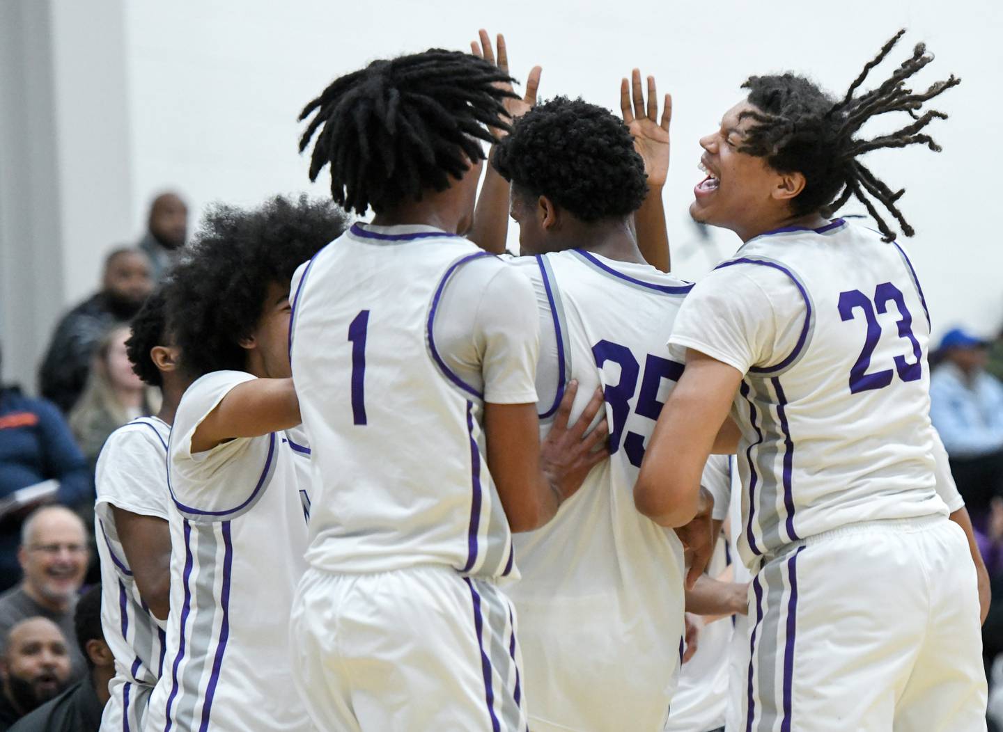 Mount Saint JosephÕs Tyonne Farrell, #23, celebrates with teammates in the second half of a high school basketball game against New Town, Tuesday, Jan. 3, 2023, in Baltimore. Mount Saint Joseph won 95-43.