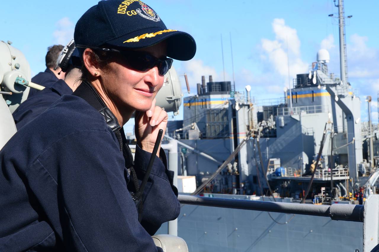 Yvette Davids, while serving as commanding officer of guided-missile cruiser USS Bunker Hill in 2014, looks on as her crew brings supplies aboard at sea. Now a vice admiral, Davids has been nominated as the first woman Naval Academy superintendent.