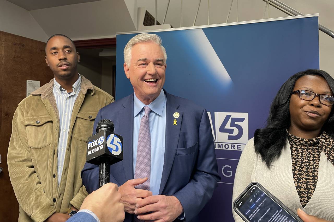 U.S. Senate candidate David Trone speaks to reporters after participating in a debate sponsored by Fox45, The Baltimore Sun and the University of Baltimore on Friday, April 19, 2024. He's flanked by Prince George's County Council members Edward Burroughs III and Krystal Oriadha.