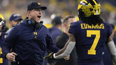 John next? Jim Harbaugh leads Michigan to college football title with 34-13 win