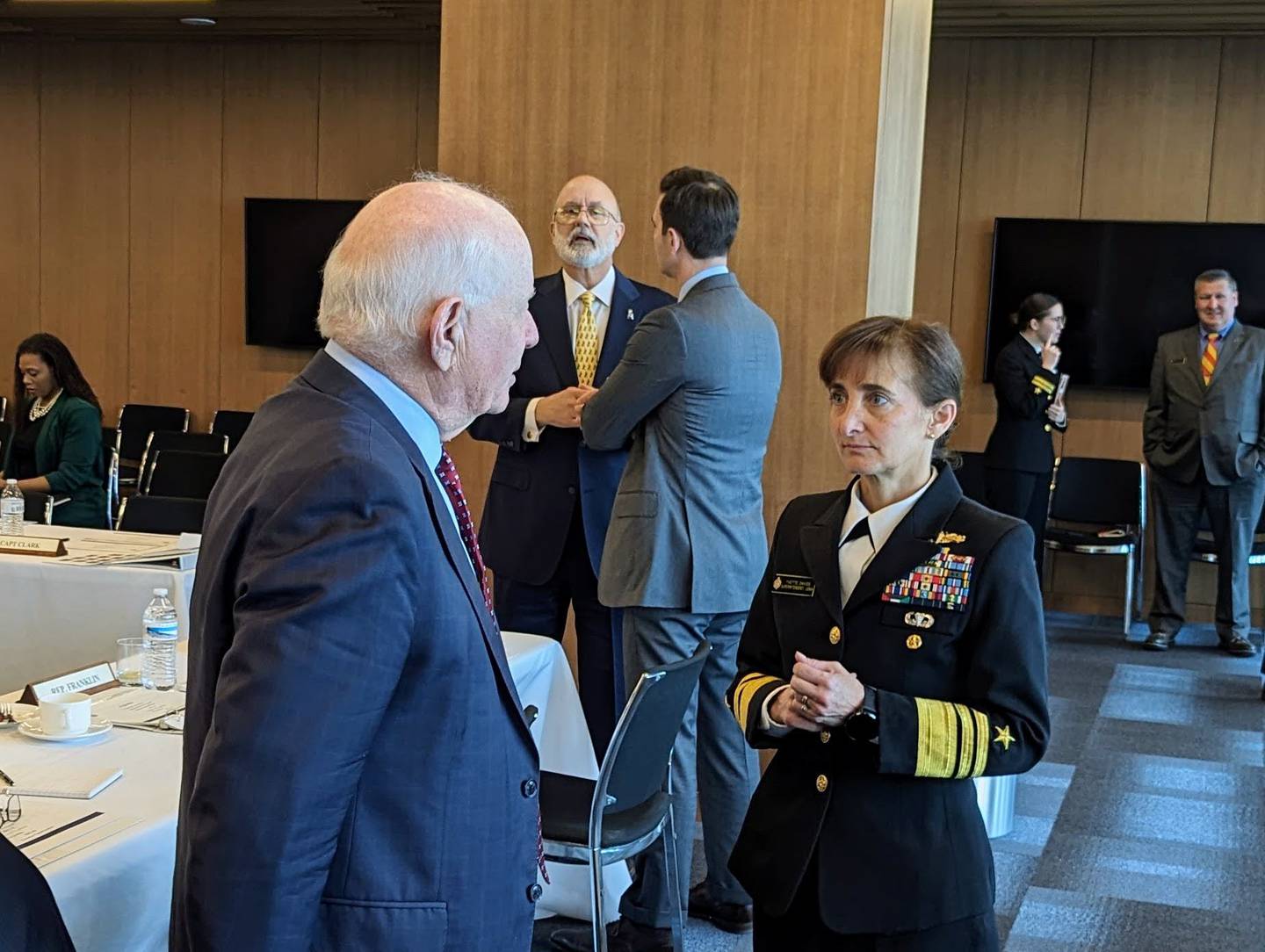 Vice Adm. Yvette Davids talks with U.S. Sen. Ben Cardin on Tuesday, March 19 at the Naval Academy Board of Visitors meeting in Annapolis. Davids is the first woman academy superintendent.