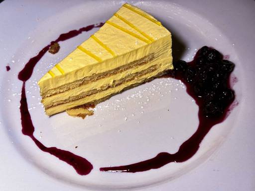 Torta Al Limoncello, which is spongecake with limoncello infused mascarpone cream and blueberry compote.