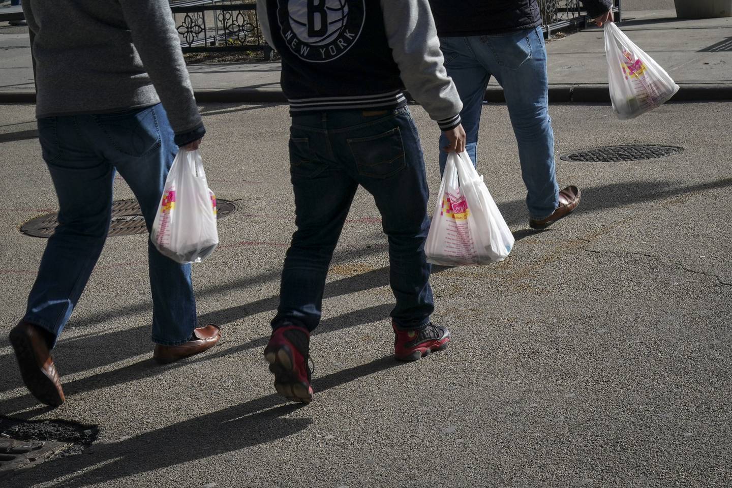 NEW YORK, NY - JANUARY 15: People carry plastic bags during the lunch hour in Lower Manhattan, January 15, 2019 in New York City. New York Governor Andrew Cuomo is planning to push for a statewide ban on single-use plastic shopping bags as part of his 2019 budget, which he is scheduled to introduce in Albany on Tuesday.