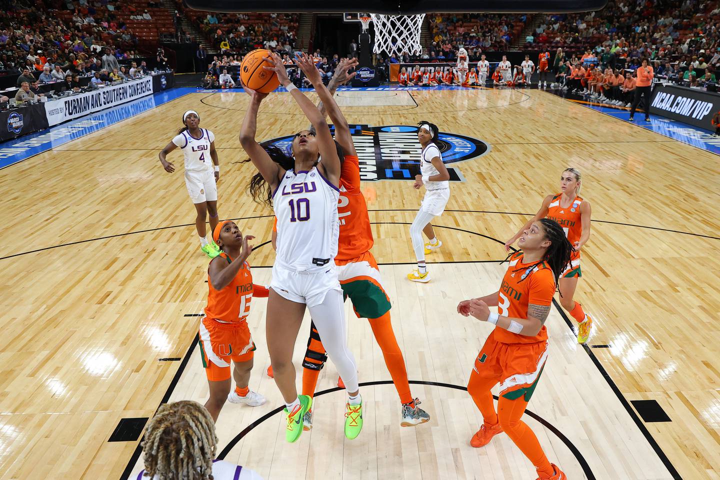GREENVILLE, SOUTH CAROLINA - MARCH 26: Angel Reese #10 of the LSU Lady Tigers shoots the ball against the Miami Hurricanes during the third quarter in the Elite Eight round of the NCAA Women's Basketball Tournament at Bon Secours Wellness Arena on March 26, 2023 in Greenville, South Carolina.