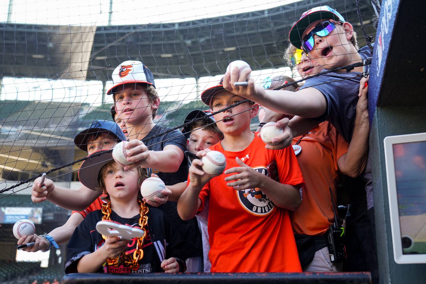 Young Baltimore Orioles fans beg shortstop Gunnar Henderson for autographs after a simulated game at Camden Yards on Wednesday, October 4, 2023. The Baltimore Orioles are preparing for their first postseason game in the ALDS against the Texas Rangers on Saturday.