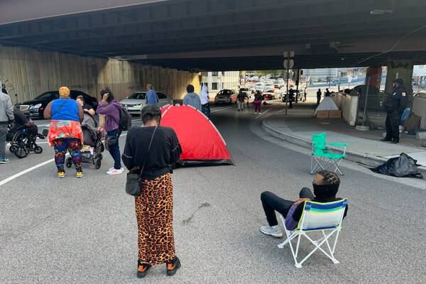 Protesters block ramp onto I-83 in response to city plan to remove homeless encampment