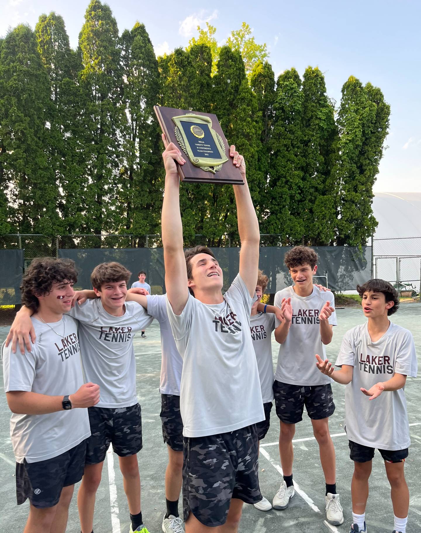 Boys' Latin's Eli Holder holds up the MIAA B Conference tennis championship plaque Thursday. The sophomore's straight set victory in the No. 3 singles match clinched the Lakers' 3-2 victory over Beth Tfiloh at Suburban Country Club in Pikesville.