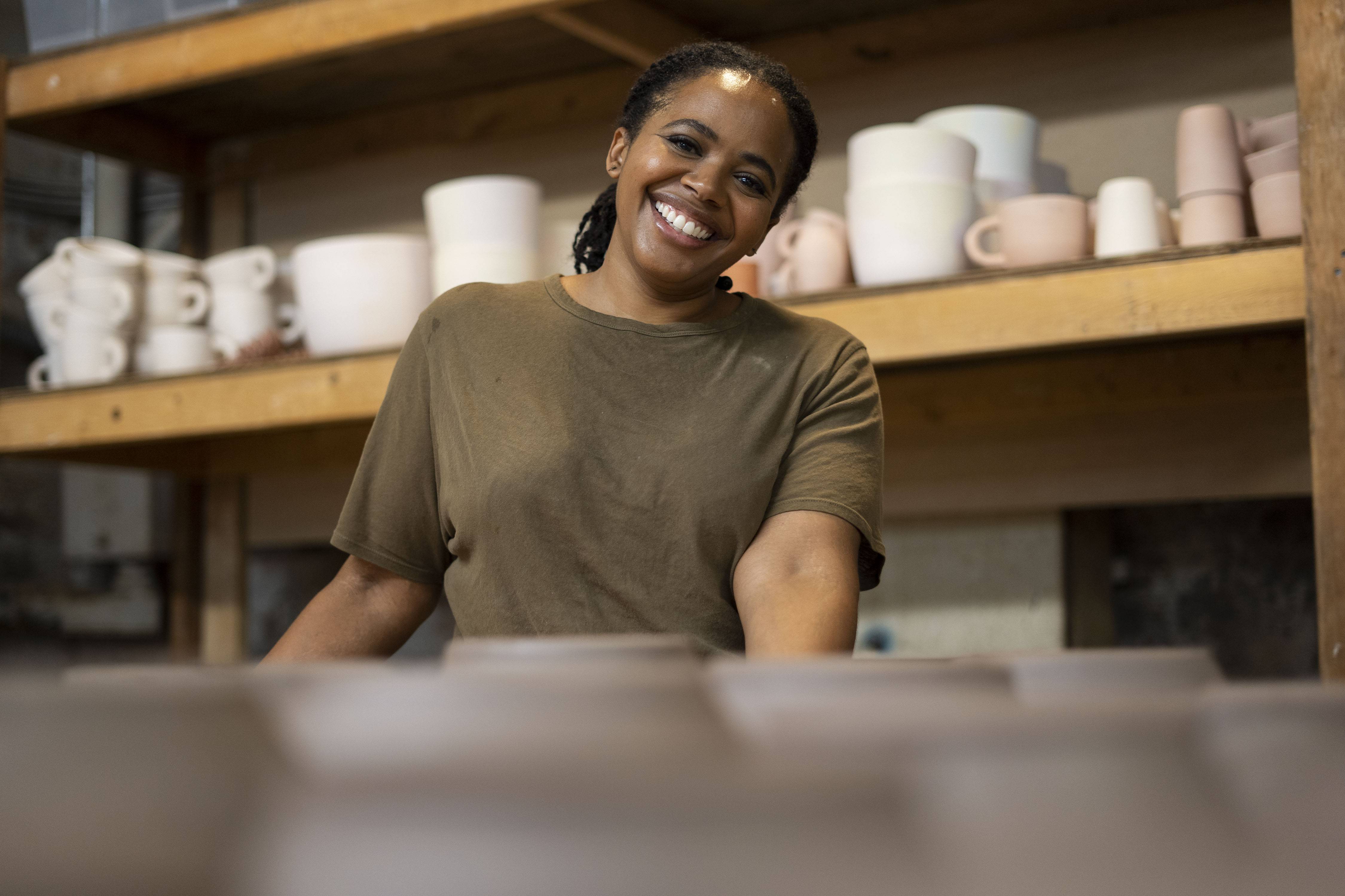 Whitney Simpkins shows some of her finished mugs and cups in her studio, Personal Best Ceramics, in Baltimore August 12, 2022.