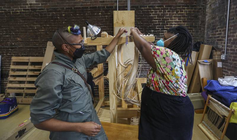 Ọmọlará Williams McCallister and Najee Haynes-Follins create baskets from local fruit trees, this one being a pear tree around the corner from their studio inside of Blue Light Junction. The two are opening a weaving center that focuses on being inclusive to anyone who wants to learn the art of weaving.