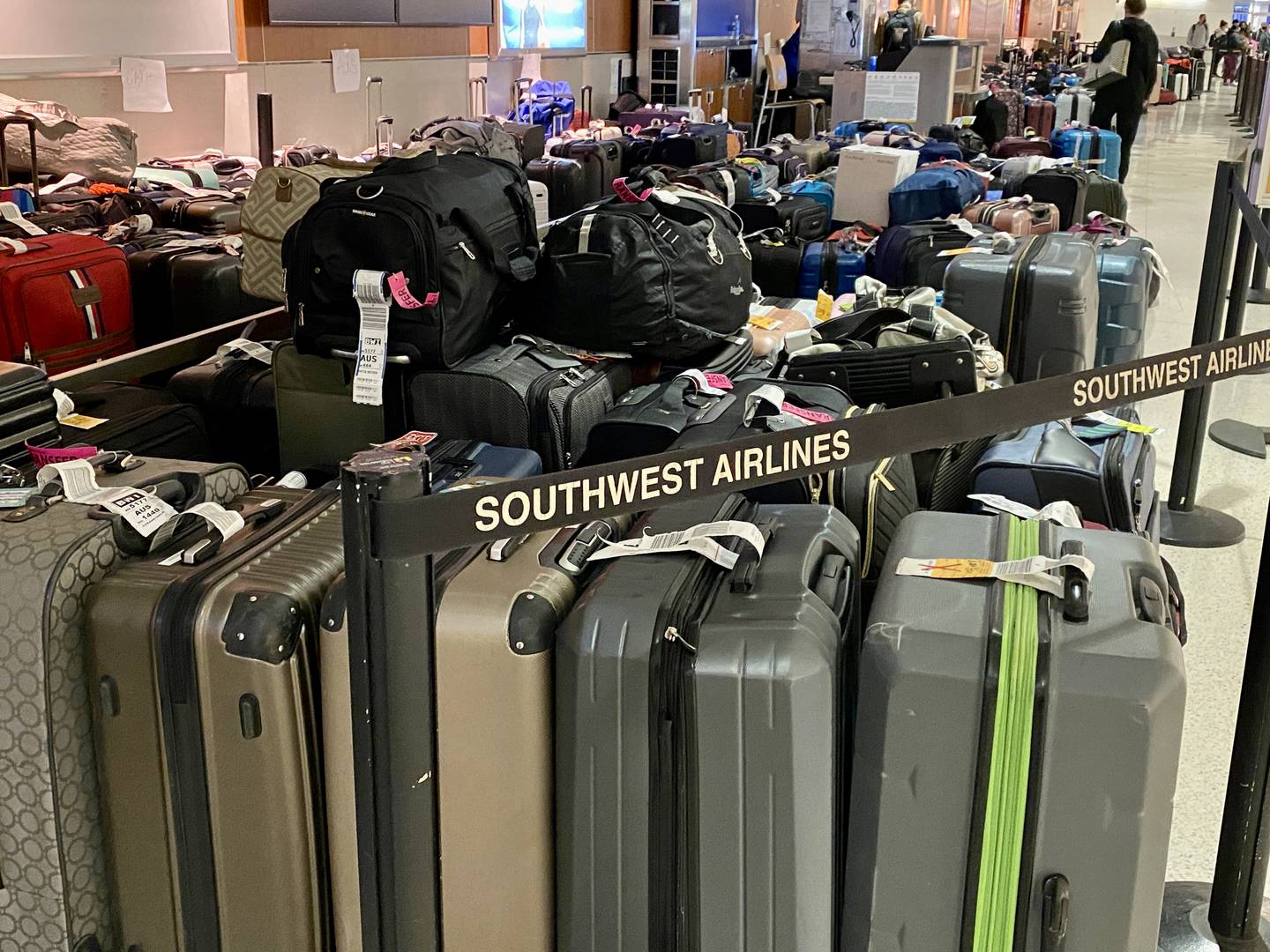 Hundreds of suitcases sit at BWI waiting for their owners after the cancellations and delays of thousands of Southwest Airline flights caused massive disruption across the country.