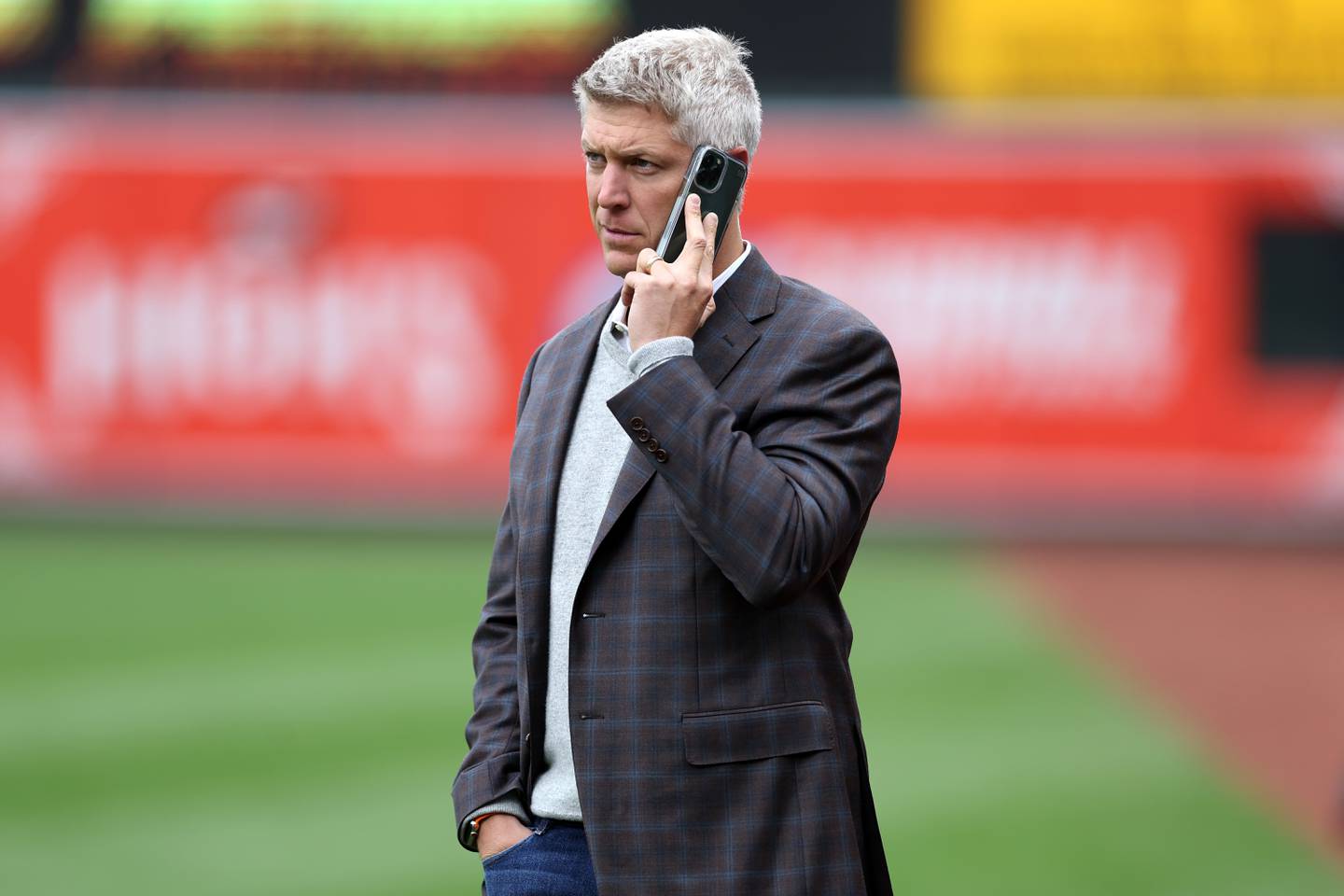 Baltimore Orioles general manager Mike Elias talks on the phone before the start of the Orioles and New York Yankees game at Oriole Park at Camden Yards on April 08, 2023 in Baltimore, Maryland.