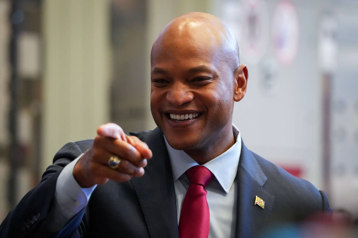 Maryland Gov. Wes Moore points to acknowledge a supporter before taking his seat at U.S. President Joe Biden’s speaking event on 2/15/23. Biden spoke to members of the IBEW Local 26 union at their office in Lanham, Maryland