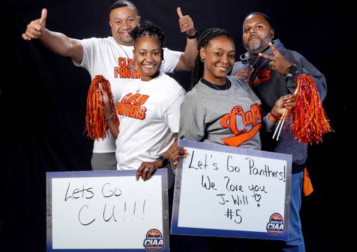 Claflin fans Missy and Josh Reddick (l) and Lakisha and Nykema Alexander brought their home made sign to support their team.