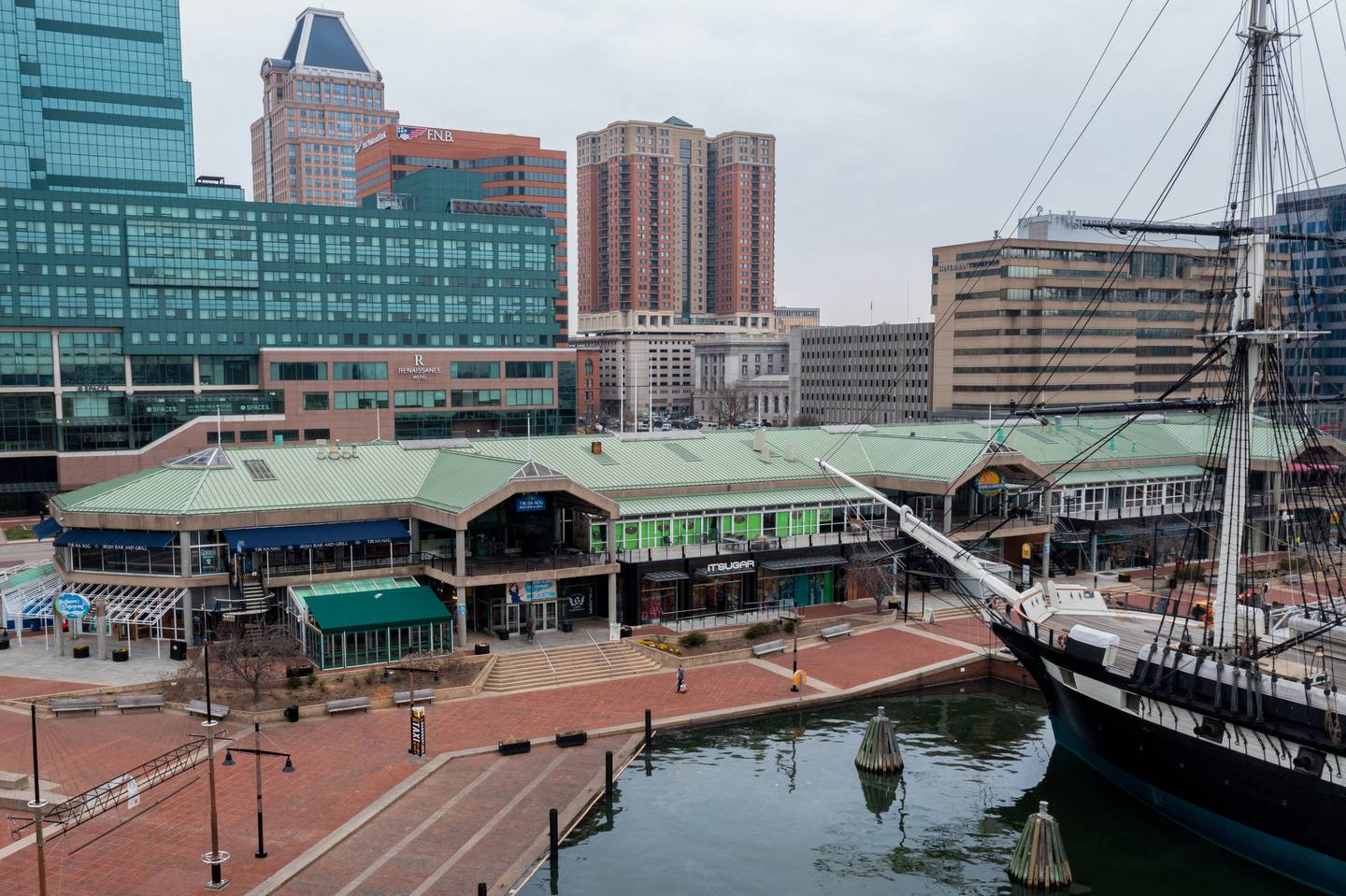 A view of Baltimore's Inner Harbor and historic ship taken with a drone on Friday, March 17. Several property and business owners say they have concerns about the low levels of foot traffic in the district, which they need to stay in business.