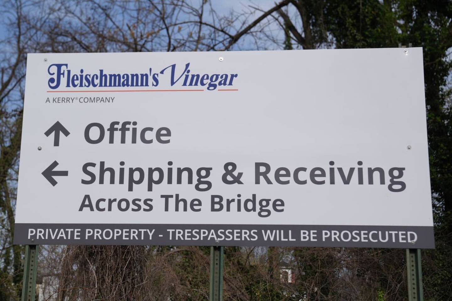 A sign pointing visitors toward the main office building outside Fleischmann’s Vinegar near Baltimore’s Cold Spring neighborhood.