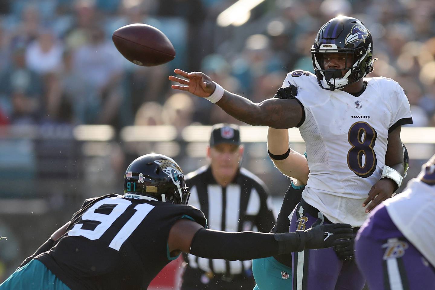 JACKSONVILLE, FLORIDA - NOVEMBER 27: Lamar Jackson of the Baltimore Ravens throws the ball during the second half in the game against the Jacksonville Jaguars at TIAA Bank Field on November 27, 2022 in Jacksonville, Florida.