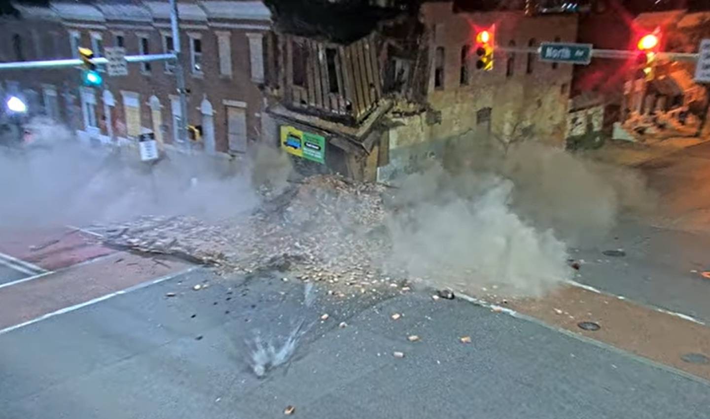 A building at the corner of E. North Avenue and N. Wolfe Street collapses after it's hit by stolen car that crashed into another car. The driver of the stolen vehicle hit a pedestrian, Alfred Fincher, before crashing into the building. Fincher was pronounced dead at the scene.