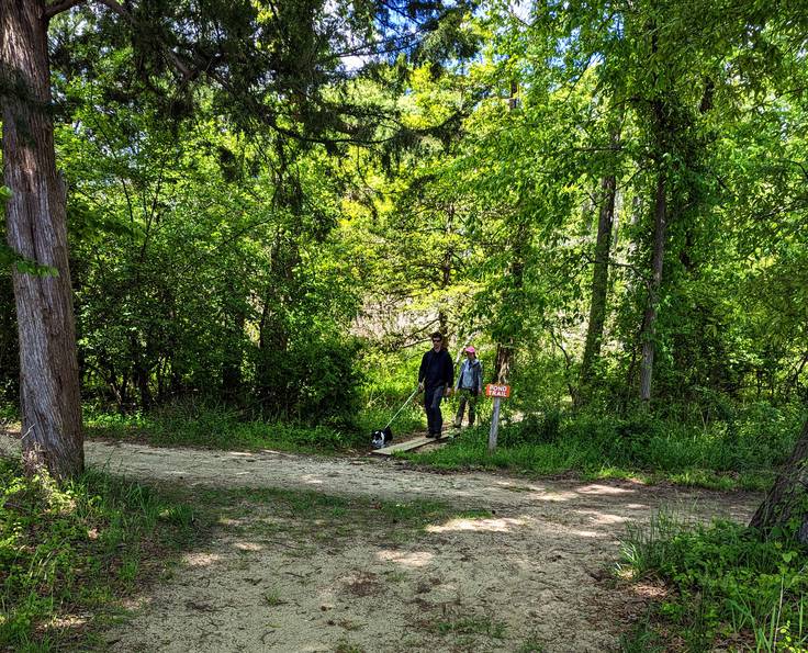 A network of trails through the 400 acres at Beverly Triton Nature Park connect wooded areas, a pond, parking facilities, a pavilion, and a narrow beach on the Chesapeake Bay.