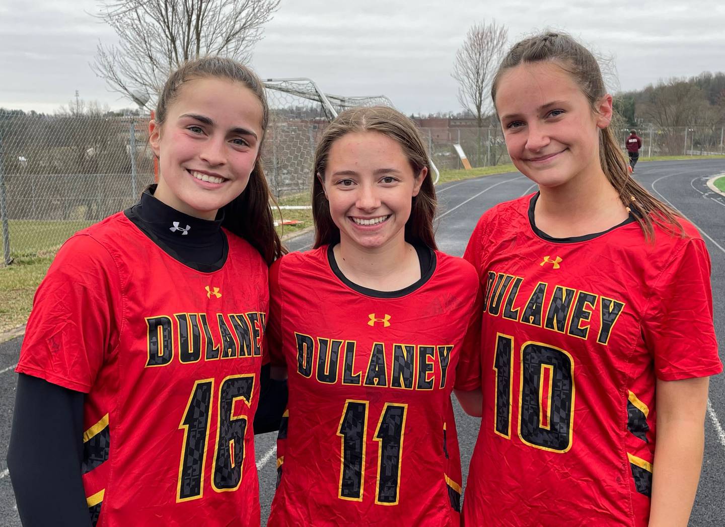 Max Yeakel (16), Audrey Simoes (11) and Anna Jones (10) celebrated Dulaney's first girls lacrosse victory over Hereford since 2018. Yeakel and goalie Simoes, with 12 saves, paced a stingy defense while Jones had three goals and three assists in the 9-5 win over the four-time defending Baltimore County champions Friday afternoon.