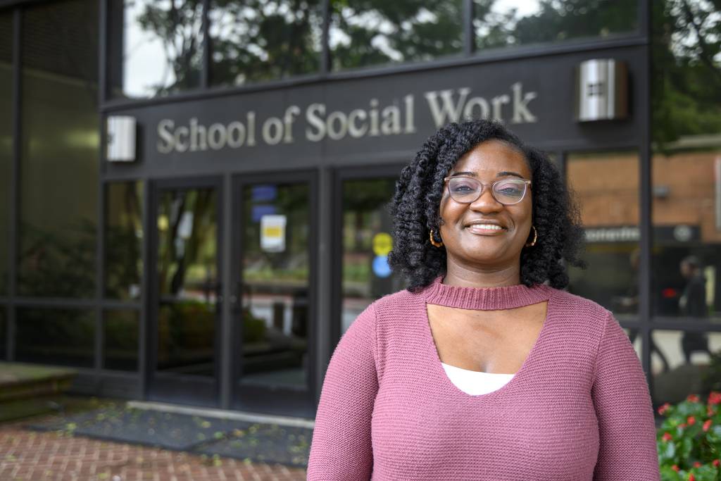 Bianca Collins, a member of the first cohort of a new fellowship for school-based mental health jointly offered by the University of Maryland and Coppin State University, outside the school of social work at UMB where she is in her last year  of earning a Master's degree, on September 25, 2023.