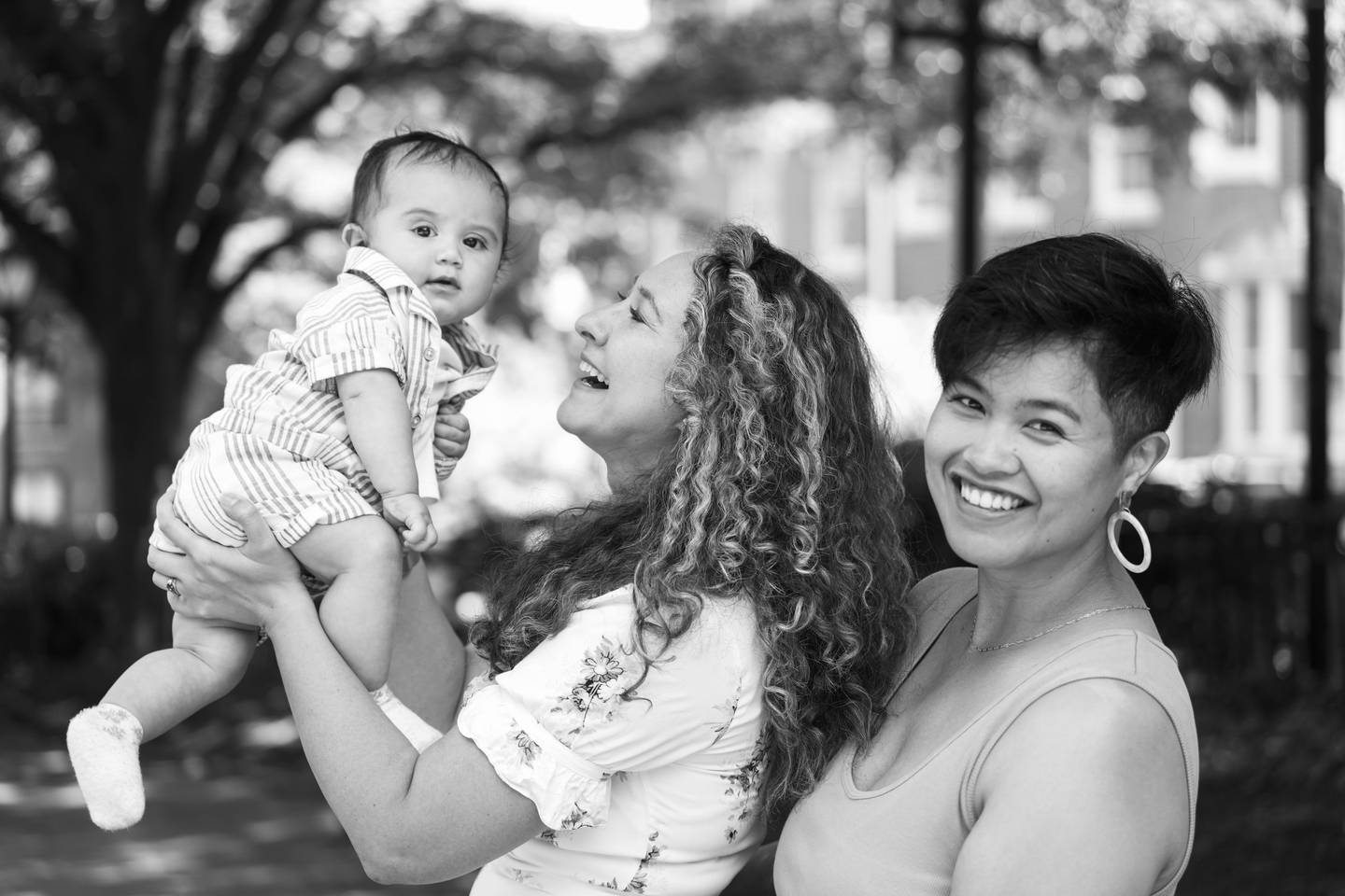 Marisa Dobson, 37, and wife Jamie Sumague, 33 pose with their baby Eden for a portrait around Mount Vernon, in Baltimore, Thursday June, 1, 2023.