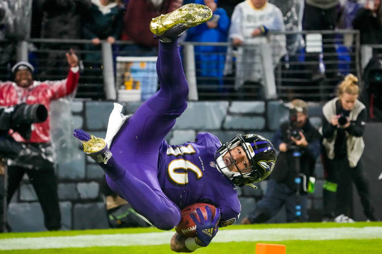Baltimore Ravens wide receiver Tylan Wallace (16) flips into the end zone to score the game-winning touchdown during overtime against the Los Angeles Rams at M&T Bank Stadium on Sunday, Dec. 10, 2023.